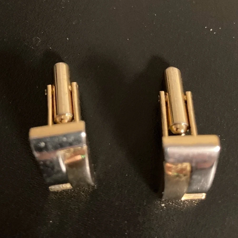 Golden and silver tone cuff links